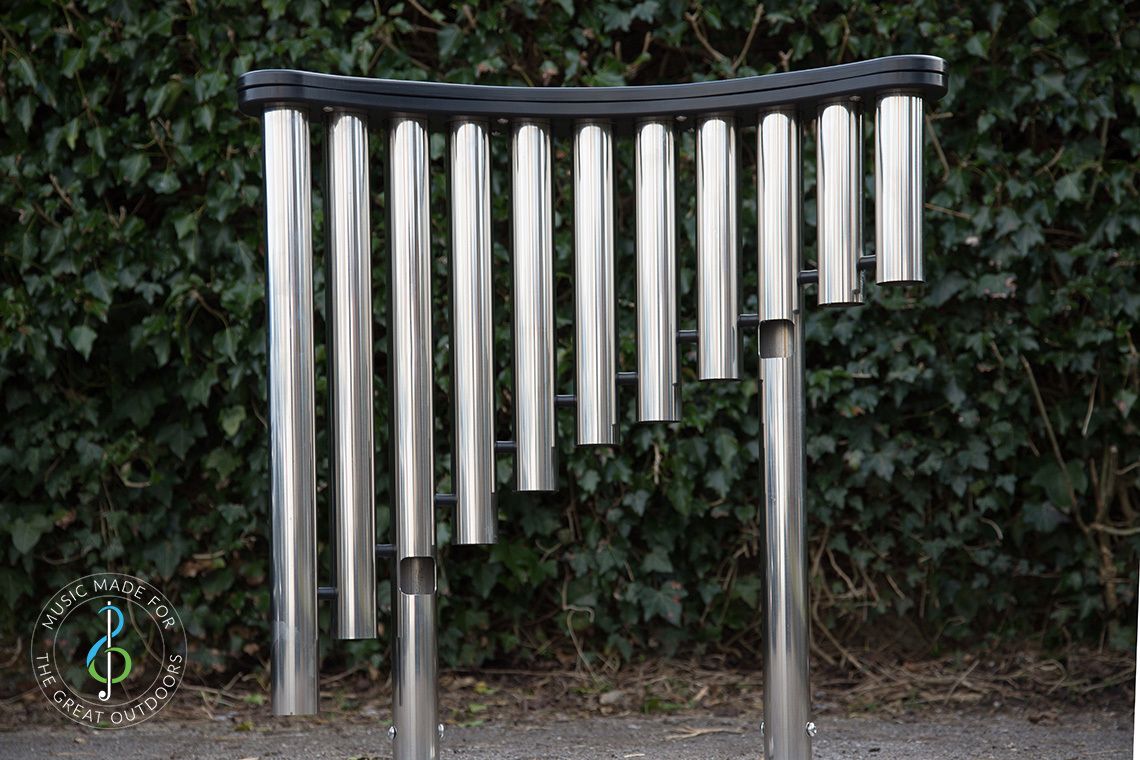 looking at the shiny downpipes of a large outdoor musical instrument