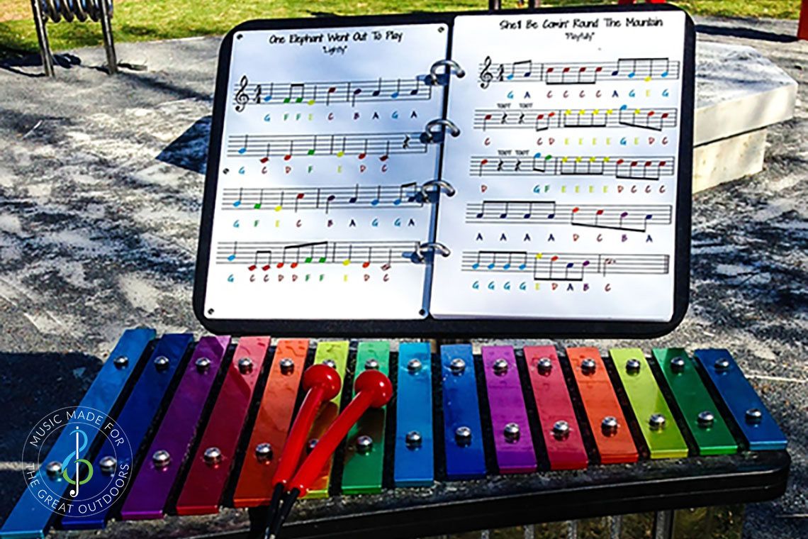 Rainbow Coloured Outdoor Xylophone in Park with music stand