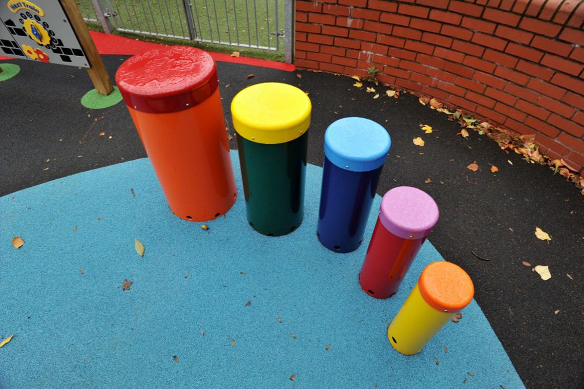 five colourful playground drums
